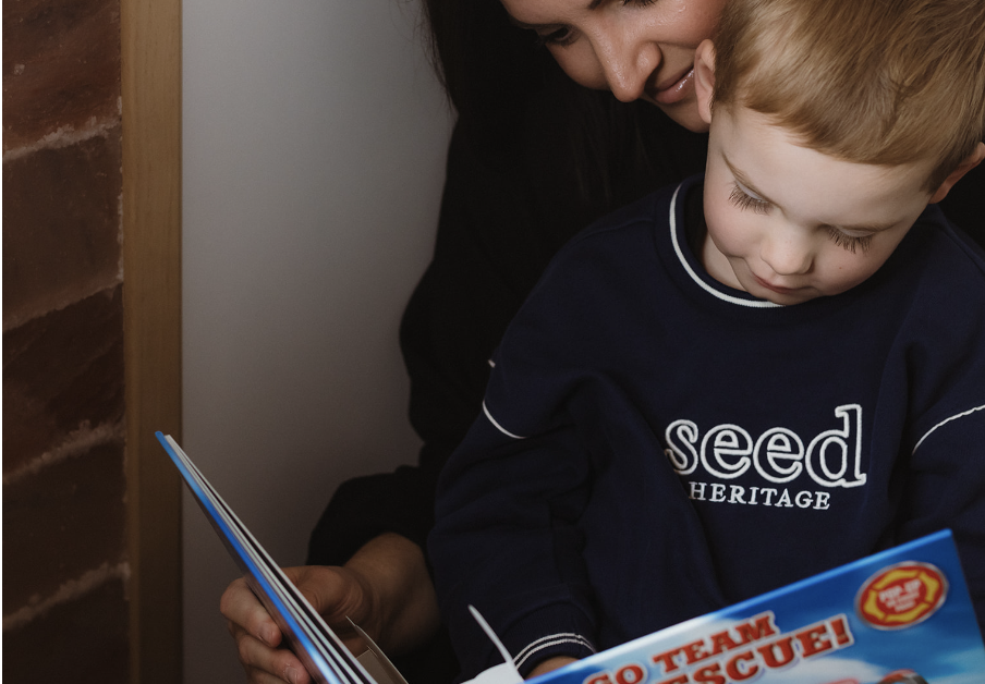 Child reading in the salt therapy room at Haús of Vitality